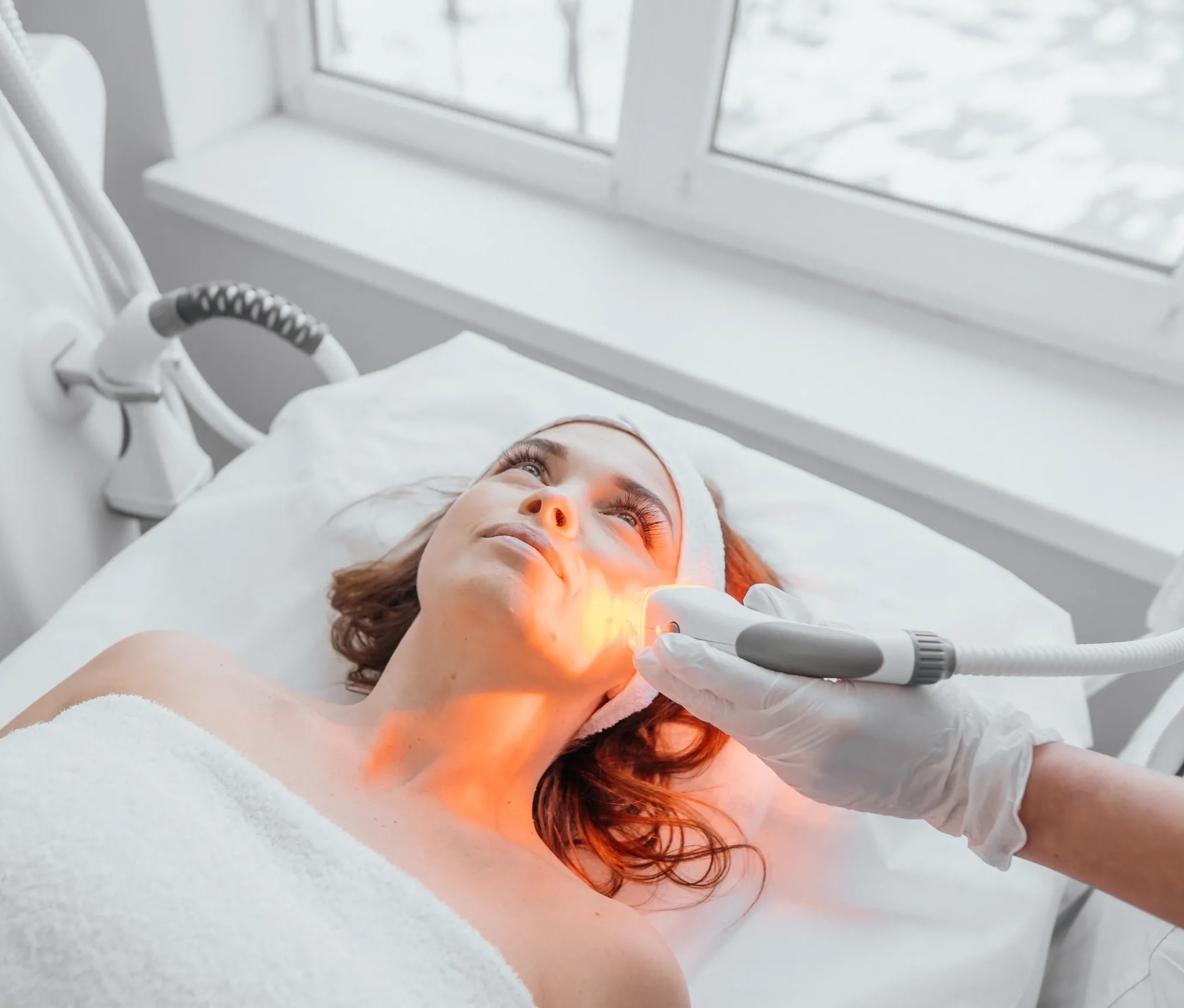 Woman receiving a non-surgical skin tightening treatment